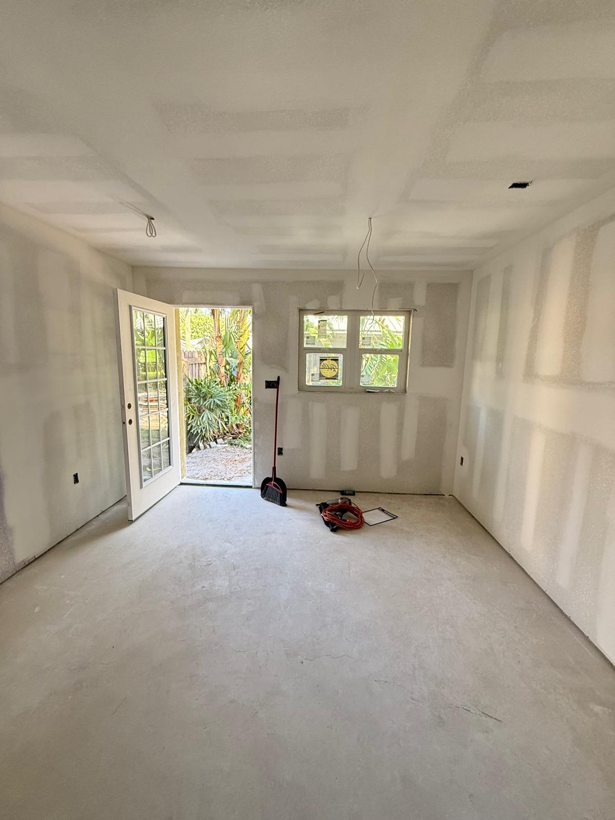 Room drywall with patio door installation