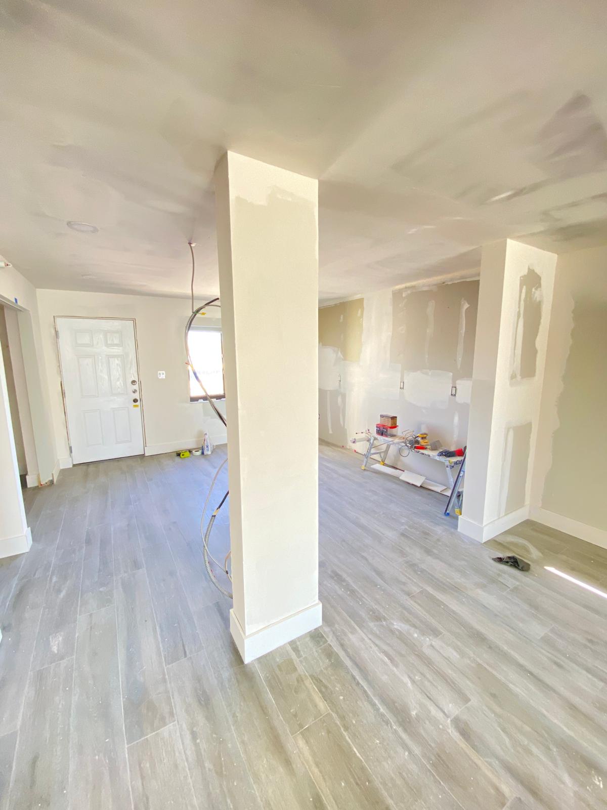 Professional drywall installation in large open room