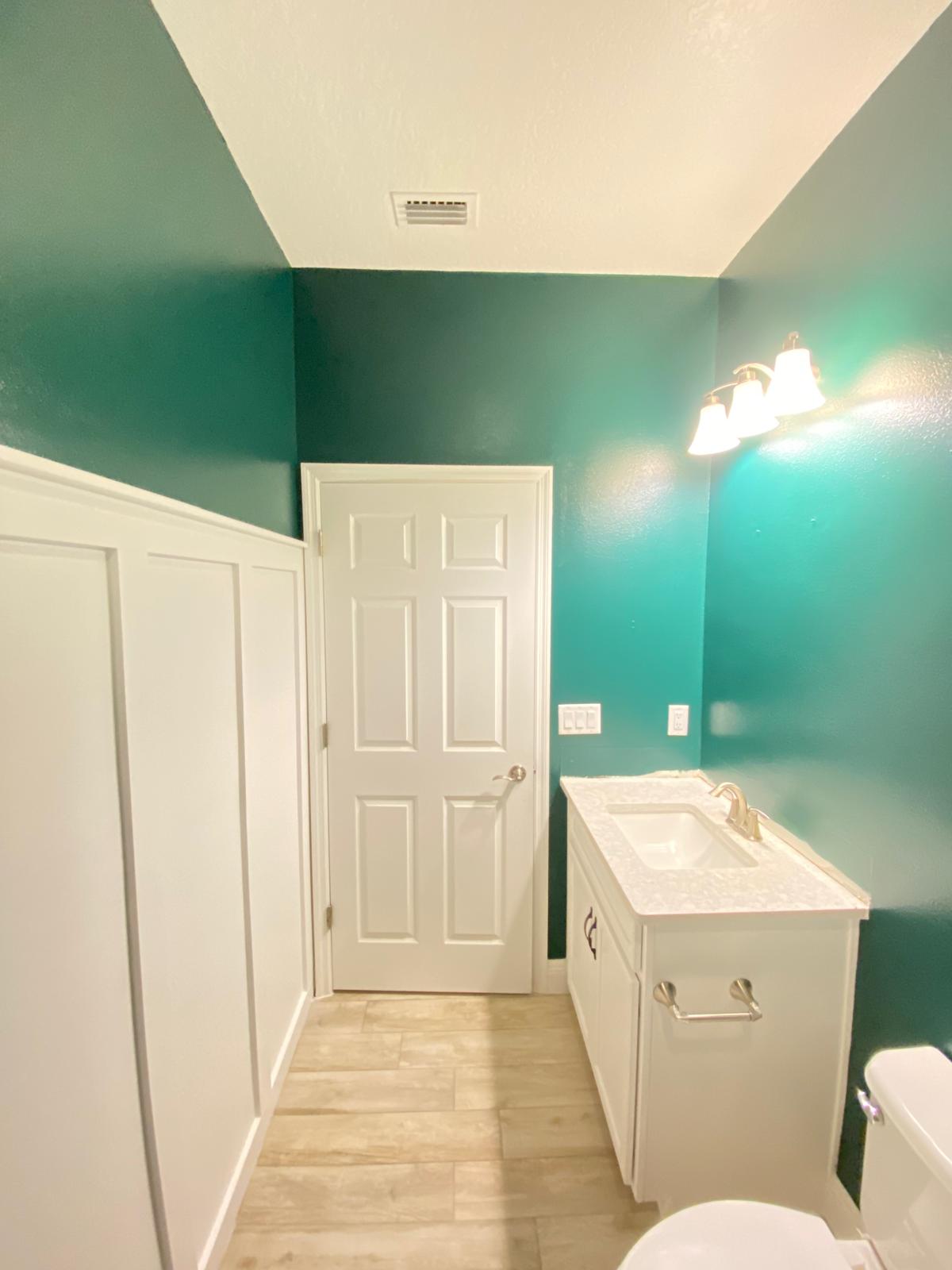 Bathroom with teal paint completed