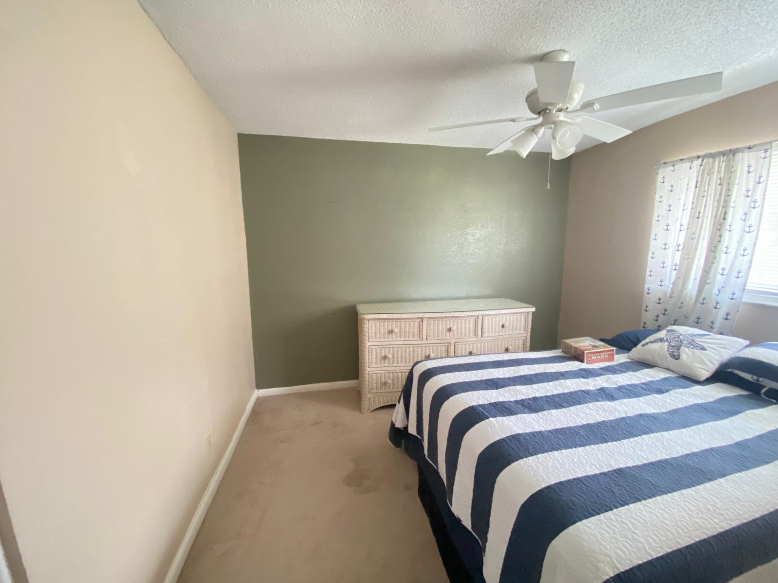 Bedroom with sage green accent wall