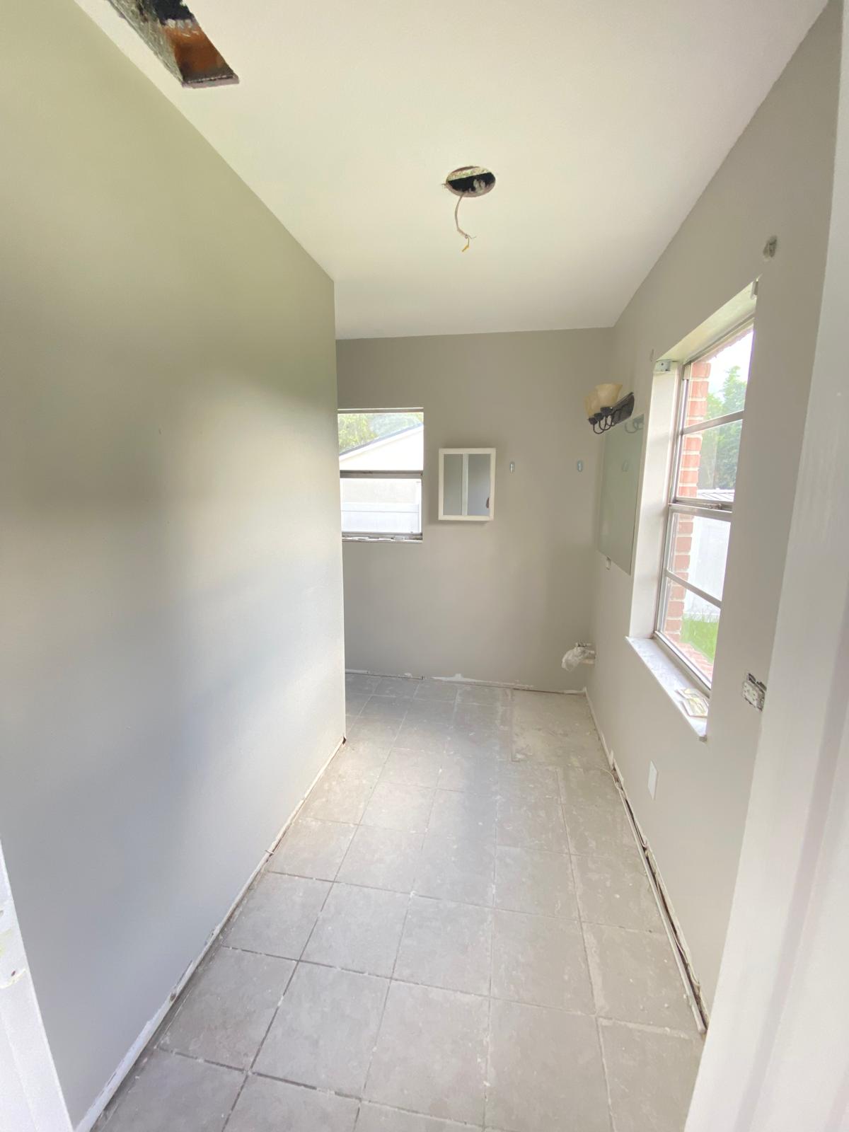 Narrow bathroom with vaulted ceiling