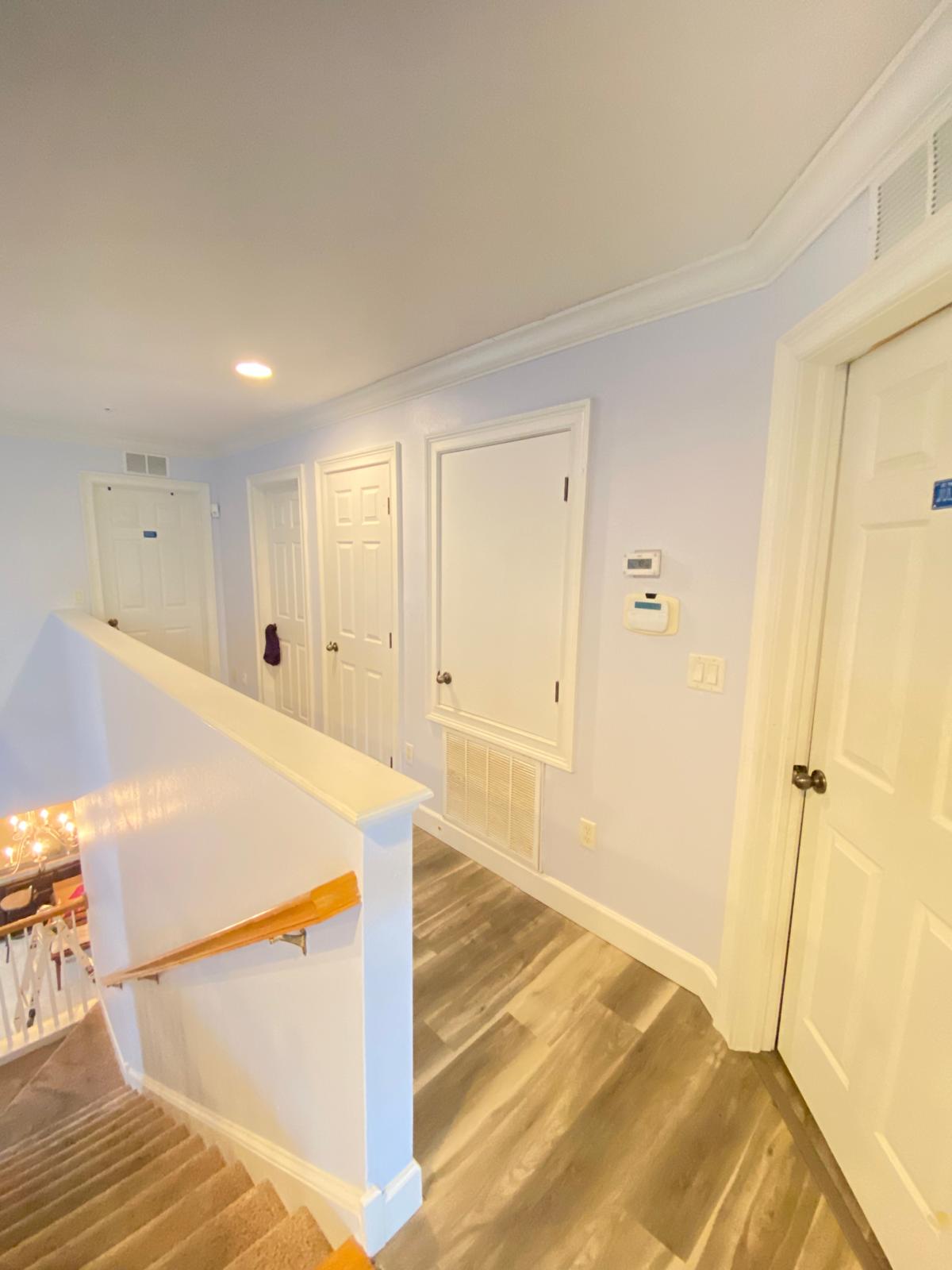 Upstairs hallway with light blue walls