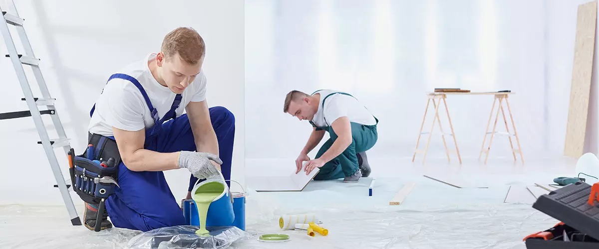 Professional drywall and painting team preparing interior space
